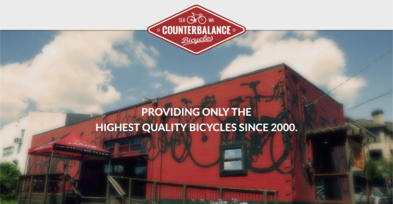 Screenshot of the Counterbalance Bicycles website with a photo of the red shop with its bicycle mural facade.
